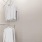 a closet with white shirts
