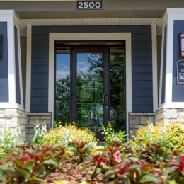 Welcome Home pretty flower bed in front of leasing office