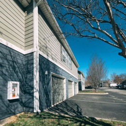 Welcome Home apartment building with garage