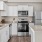 a kitchen with white cabinets