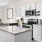 a kitchen with white cabinets