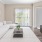 a living room with a tv and couches