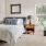 a bedroom with a bed and dresser